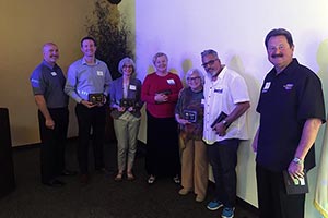 Betty January (3rd from right) receiving  EDH  Chamber new member plaque.